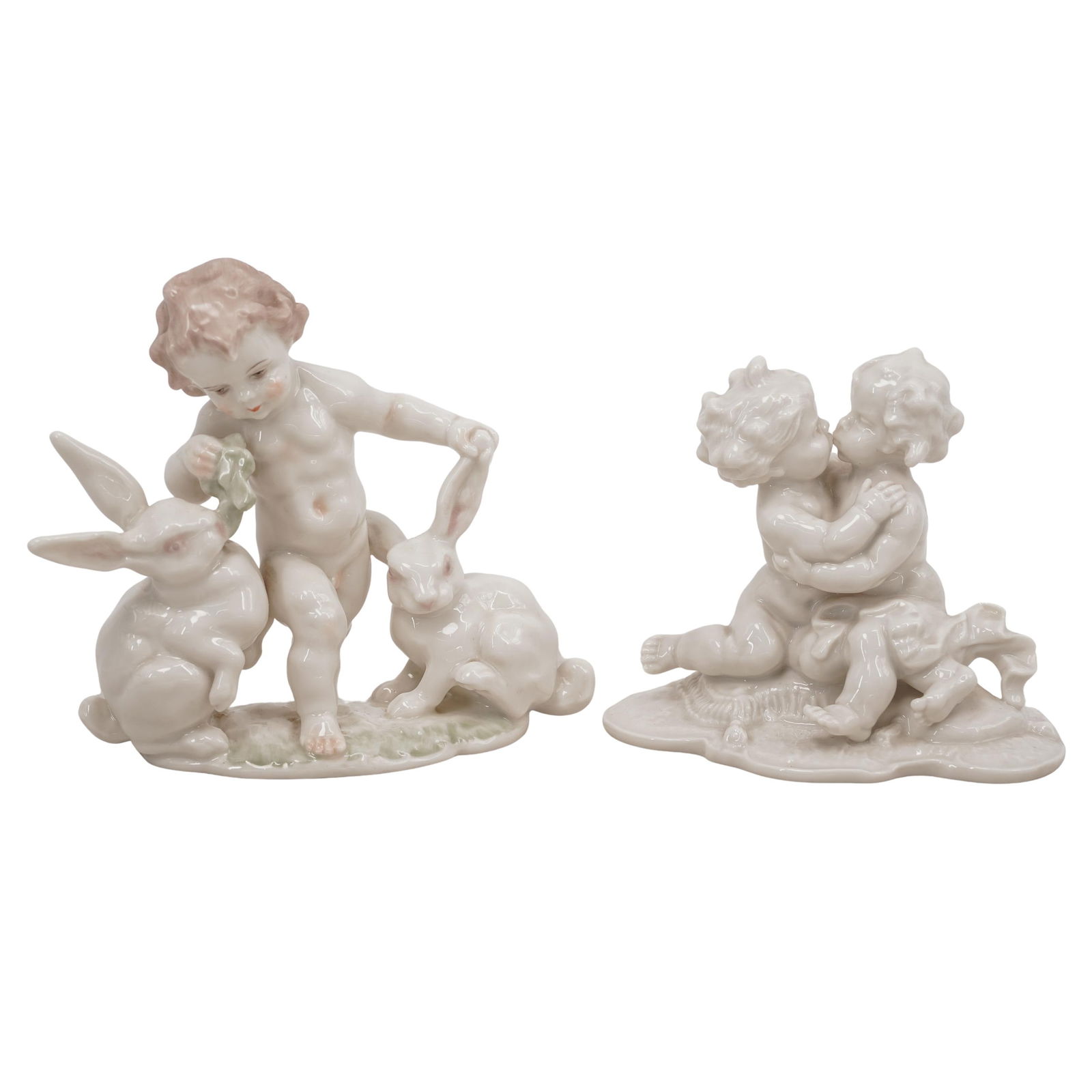 Pair of Hutschenreuther Porcelain Cherub Figurines: Pair of Hutschenreuther Porcelain Cherub FigurinesMid 20th Cent.,GermanTwo vintage German porcelain figurines depicting cherubs and rabbits figurines. One piece is marked "L.H.S.Hutschenreuther", "Kun