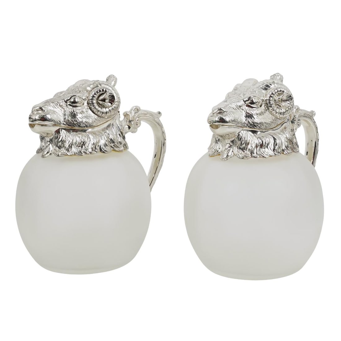 Pair of Silver Plated Ram Head Frosted Glass Pitchers: Pair of Silver Plated Ram Head Frosted Glass Pitchers Mid 20th c. Two vintage bulbous frosted glass pitchers, each featuring a highly detailed silver-plated ram’s head hinged lid and spout, and an