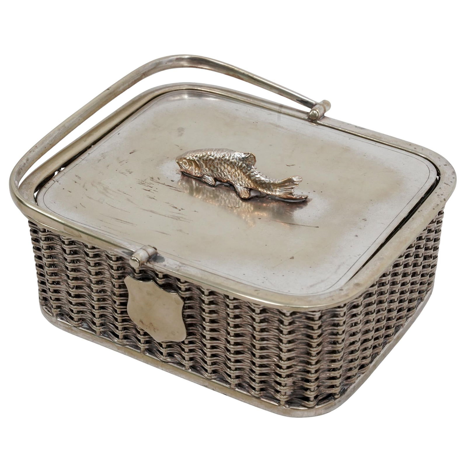 Victorian Silver Plate Sardine Box: Victorian Silver Plate Sardine Box Late 19th-Early 20th c., Europe A basket-shaped sardine box with a handle, a removable glass insert, and a lid featuring a fish finial. (Handle down) H: 2.75" W: