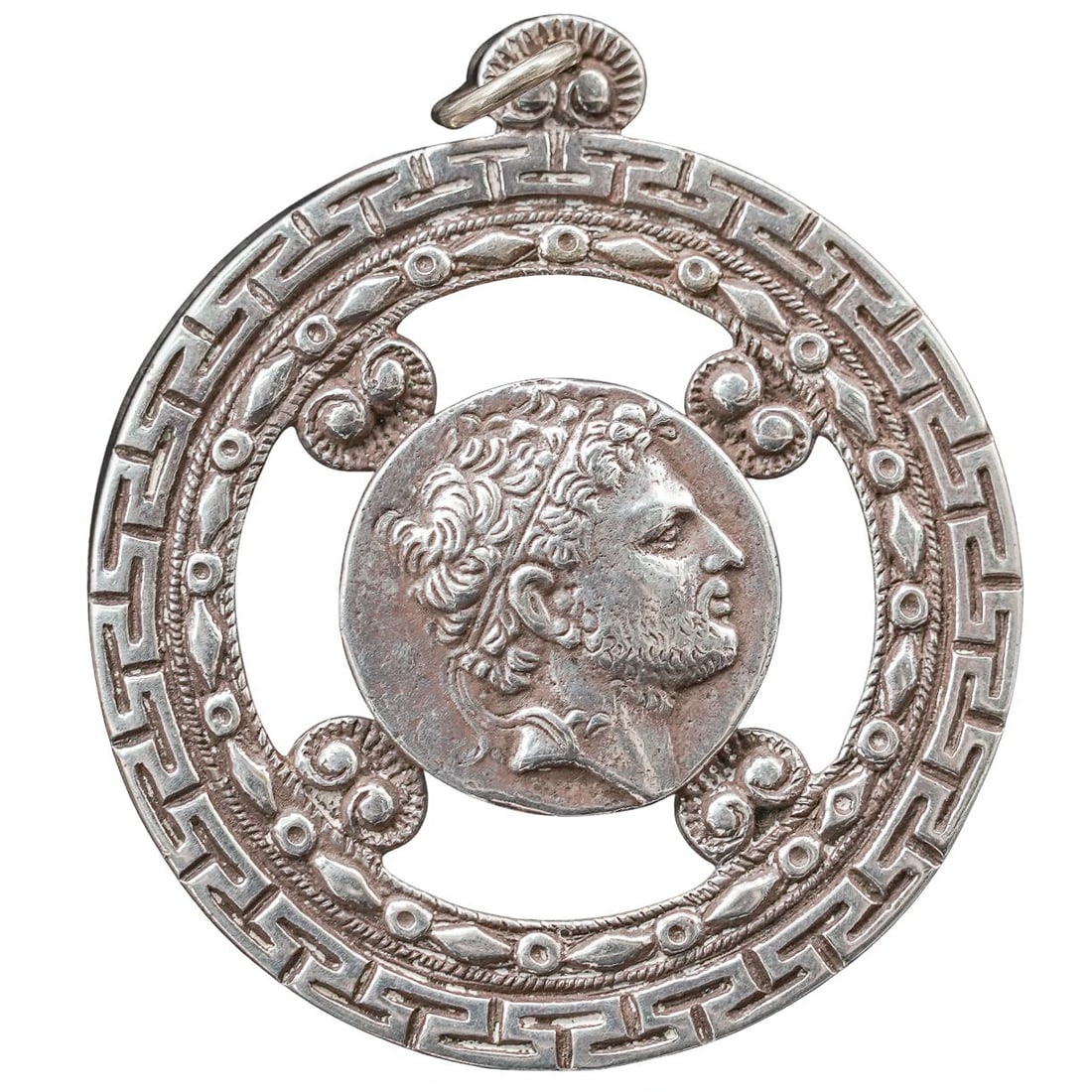 Silver Greco Roman Coin Style Pendant: Silver Greco Roman Coin Style Pendant Mid 20th Cent. Silver pendant designated in the Greek Revival style, featuring a circular openwork format coin-style medallion depicting a classical male profile