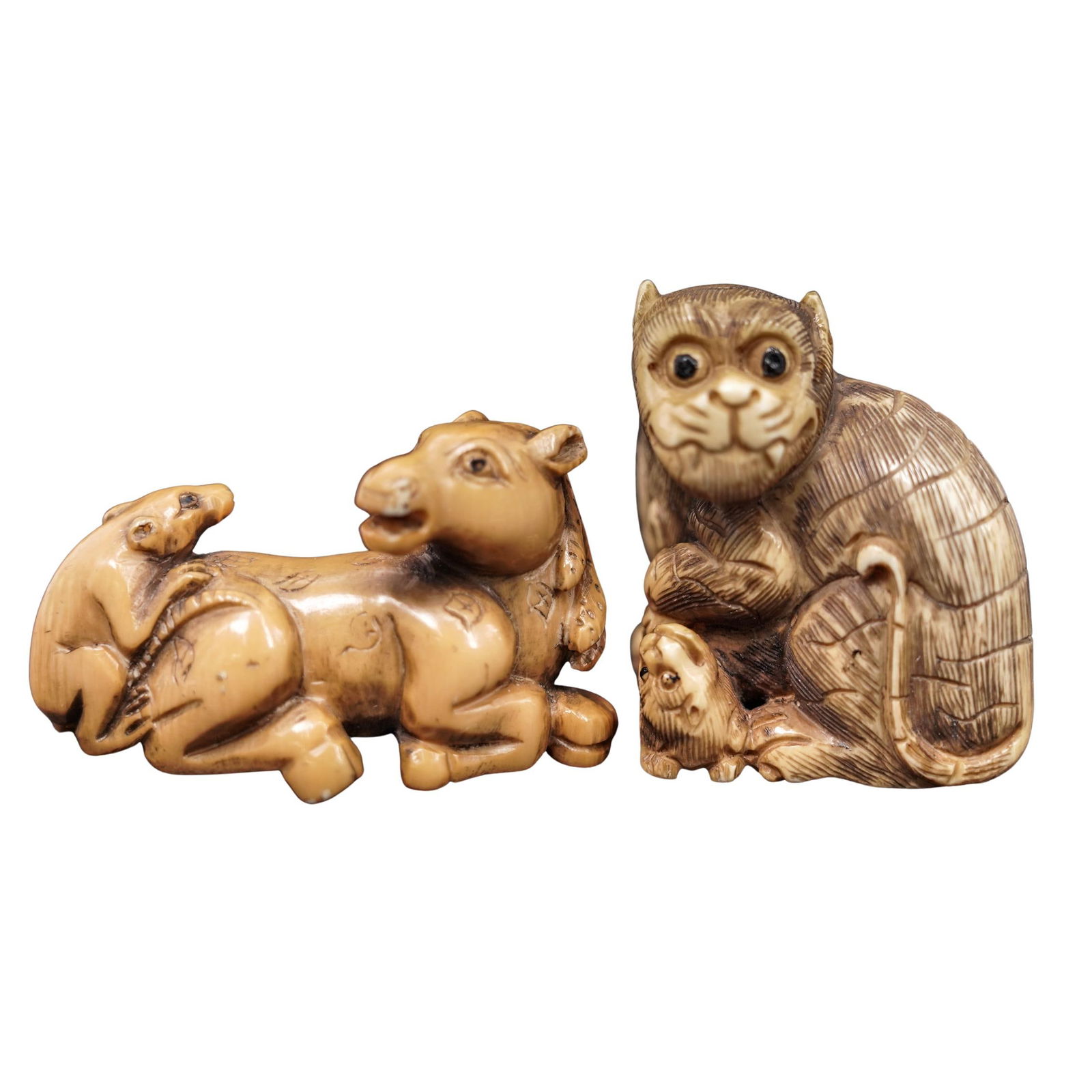 (2 Pc) Japanese Signed Carved Bone Netsukes: (2 Pc) Japanese Signed Carved Bone Netsukes 19th-20th c., Japan Carved bone yama-inu (wild dog) with a puppy, signed on the underside. Carved bone horse laying down with a rat, signed on the back. H: