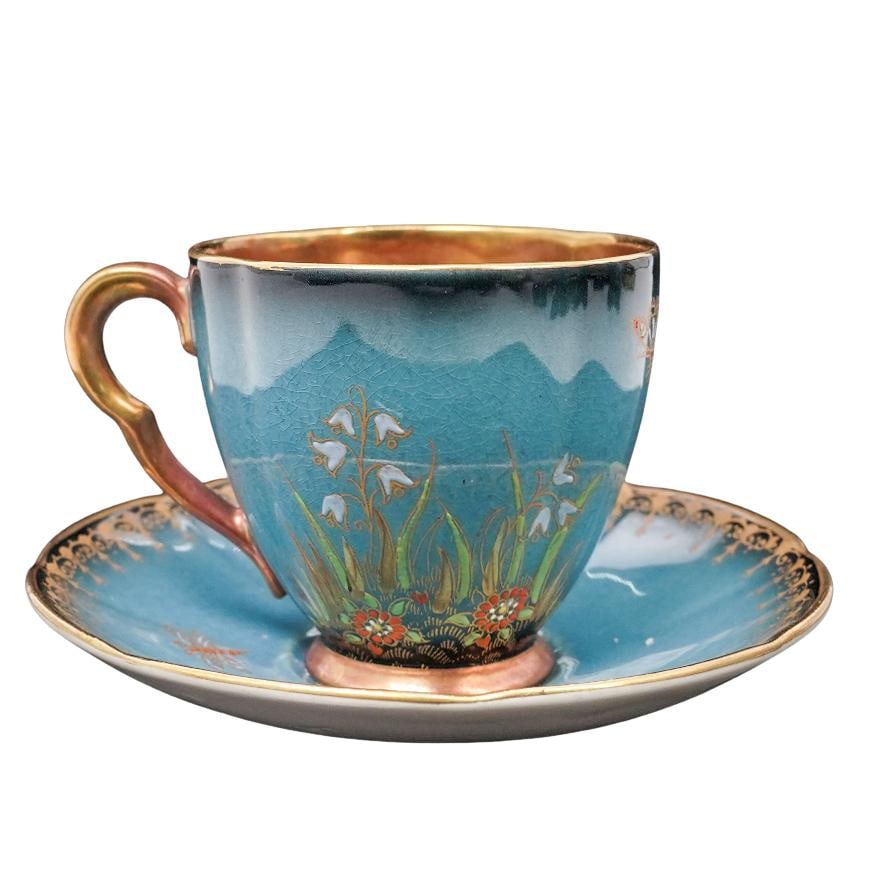 Carlton Ware "Spider's Web" Bleu Royale Teacup & Saucer: Carlton Ware "Spider's Web" Bleu Royale Teacup & Saucerc. 1940s, EnglandPorcelain teacup and saucer set, hand-decorated with a spiderweb on the cup, as well as flowers, leaves, and insects in gilt and