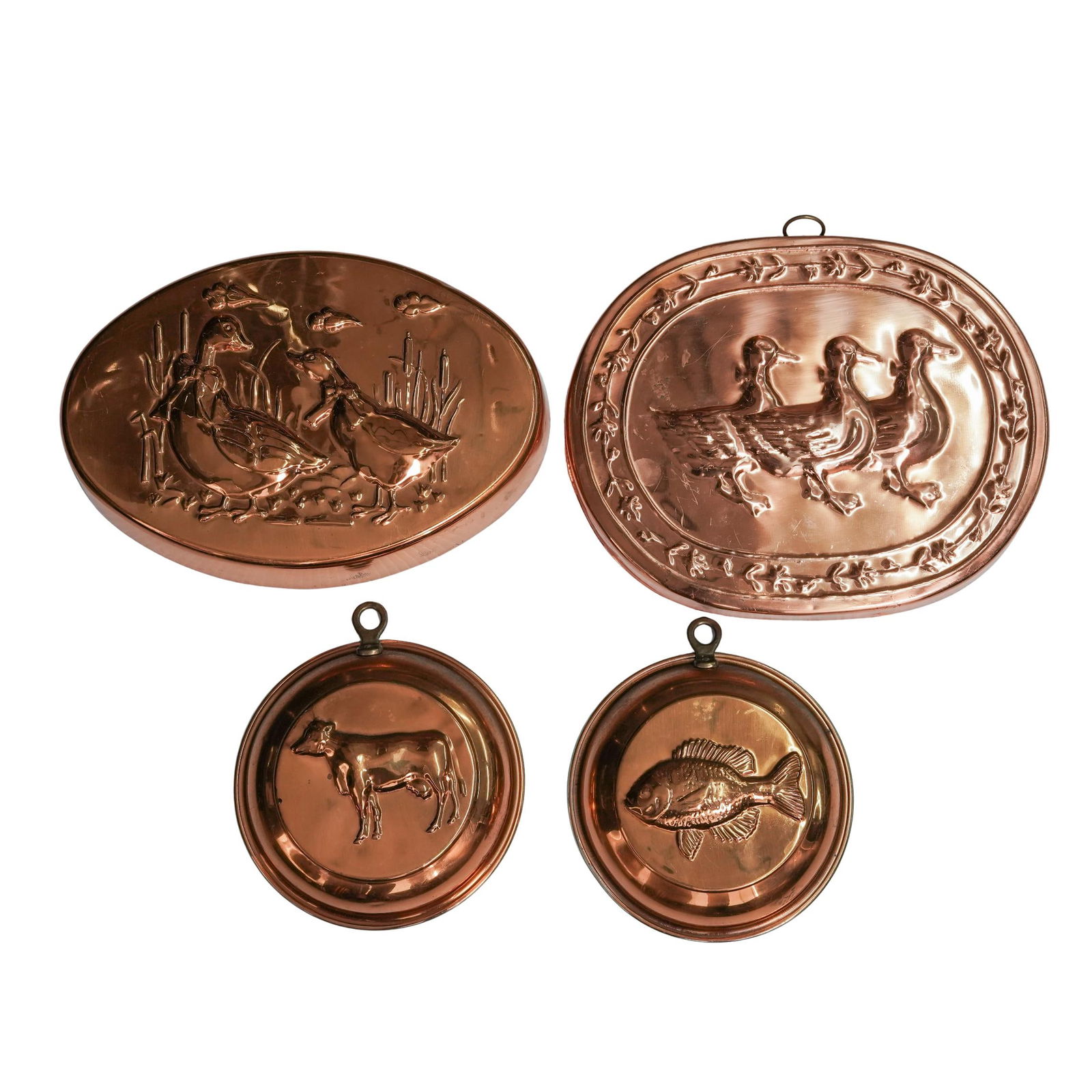 (4 pcs) Vintage Copper Washed Cooking Molds: (4 pcs) Vintage Copper Washed Cooking MoldsEarly to mid 20th century, KoreaA set of four vintage copper-washed cooking molds. Feature a fish, a cow, and two with ducks. Three marked with "Made in Kore