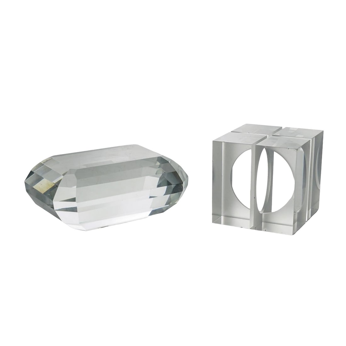 (2 Pc) MCM Faceted Heavy Crystal Sculptures: (2 Pc) MCM Faceted Heavy Crystal Sculptures Mid-20th century, USA (2 Pc) MCM Faceted Heavy Crystal Sculptures designed with multiple facets to catch and refract light, creating a shimmering effect.