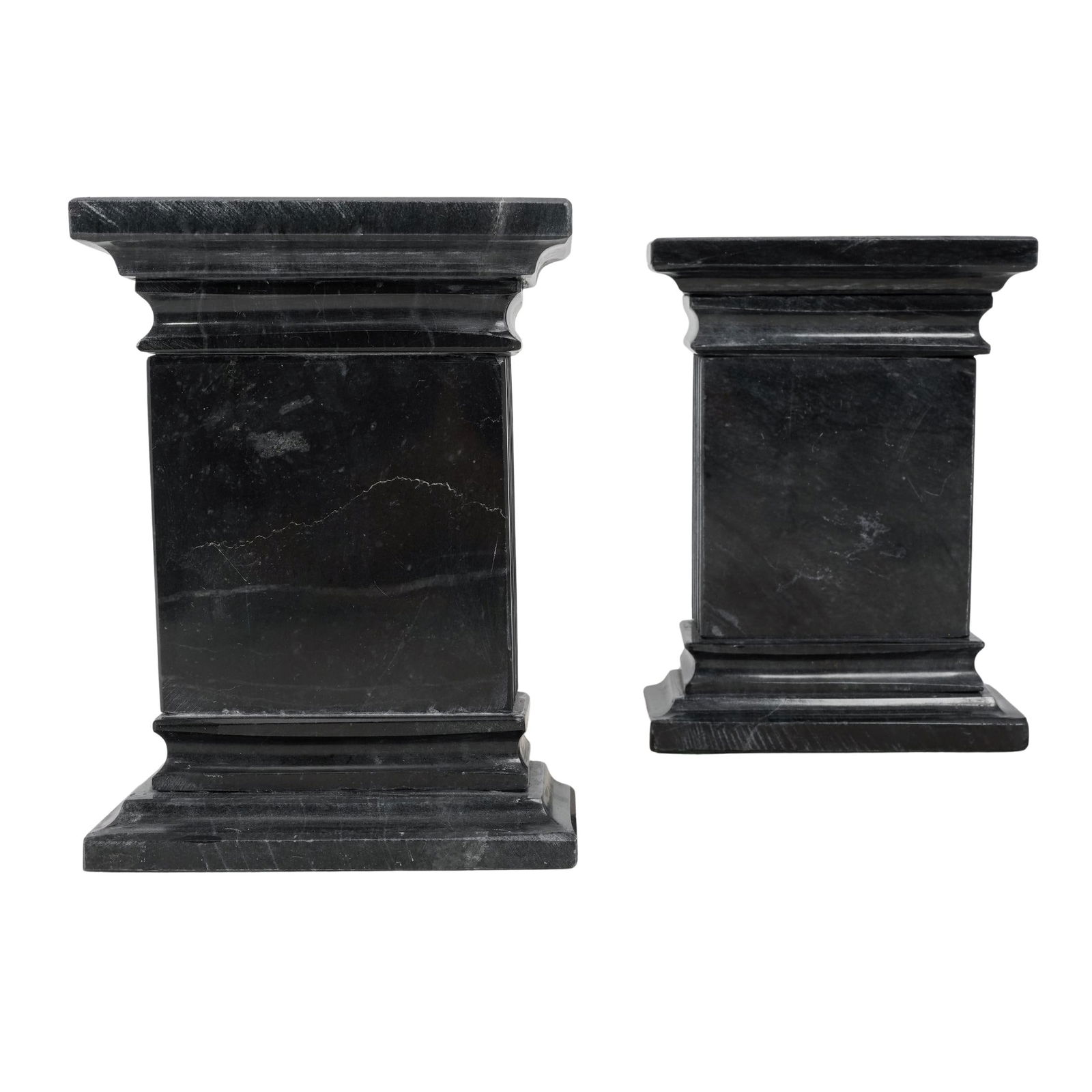 Pair of Black Marble Pillar Bookends: Pair of Black Marble Pillar Bookends 20th c. Neoclassical black marble bookends carved to resemble ancient stone facades. H: 7" W: 2.5" D: 5.25"
