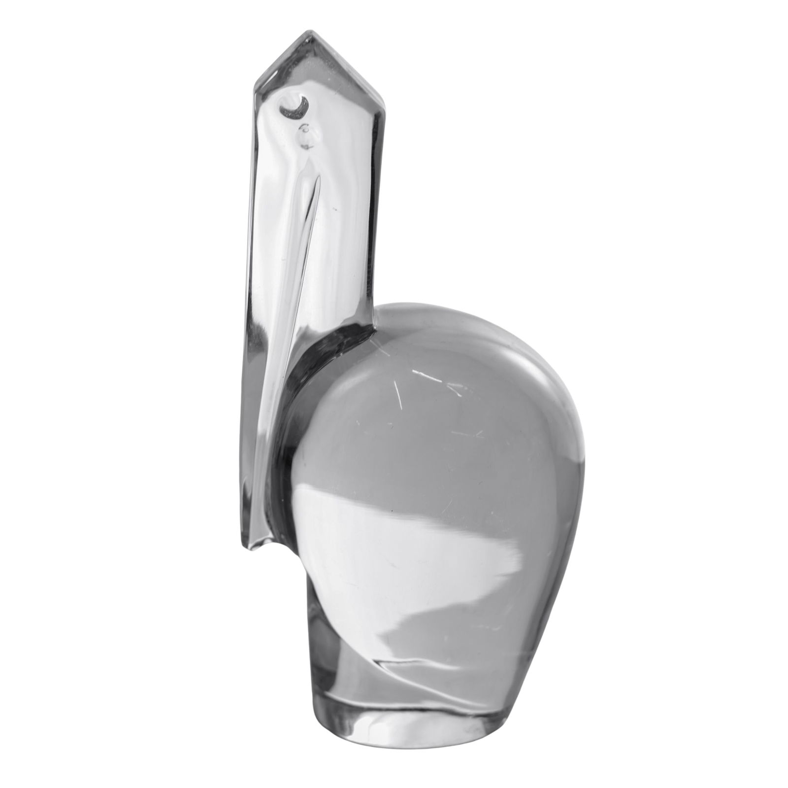 Baccarat Crystal Pelican Figurine: Baccarat Crystal Pelican FigurineMid 20th Cent. FranceThis Baccarat crystal figurine is an elegant study in minimalist form and light. Sculpted from a single, flawless block of lead crystal, the piece