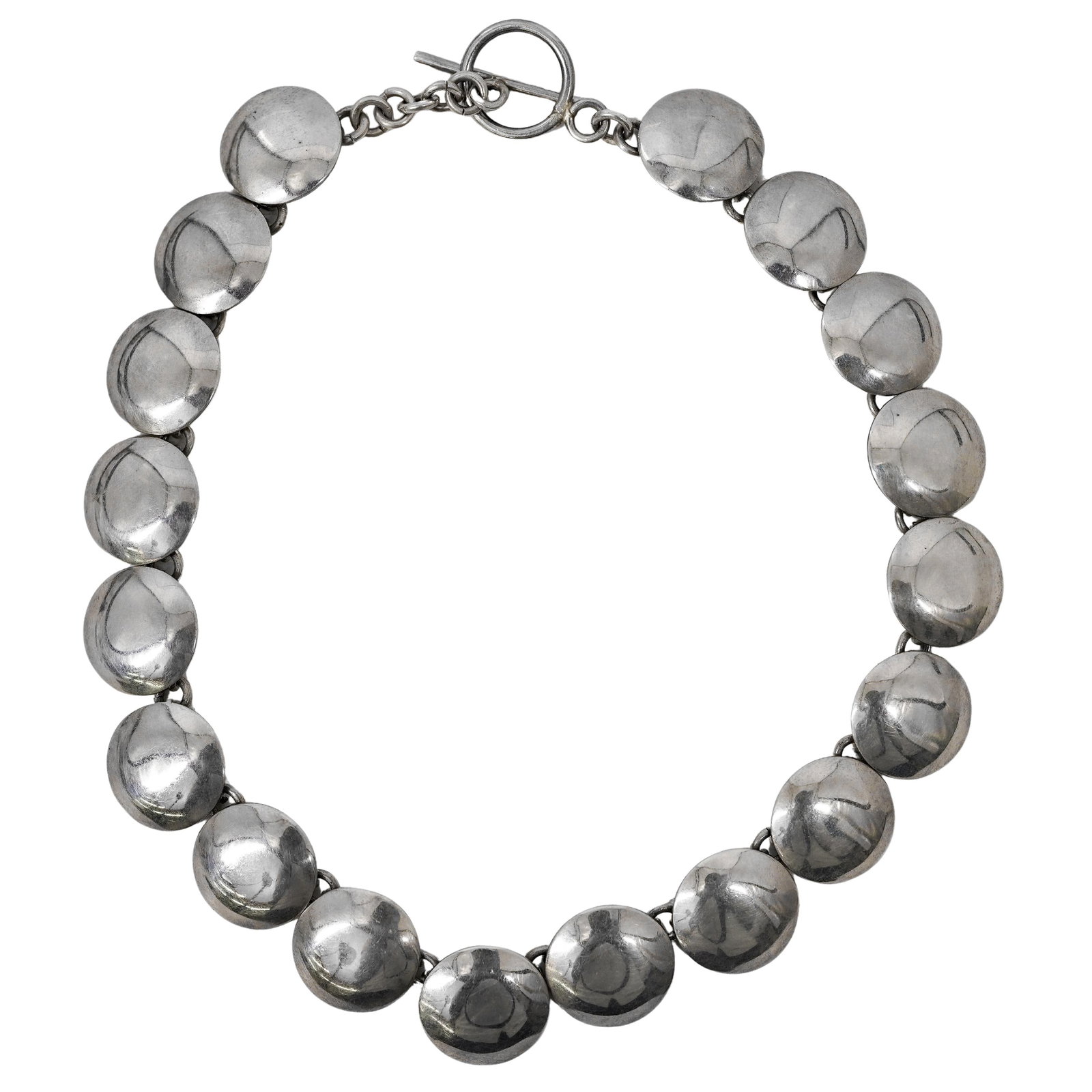 Mexican Sterling Silver Dome Concho Necklace: Mexican Sterling Silver Dome Concho Necklace Mid 20th Cent., Mexico Mexican sterling silver 'dome concho' necklace, featuring a continuous line of hand domed, convex sterling discs, individually hinge