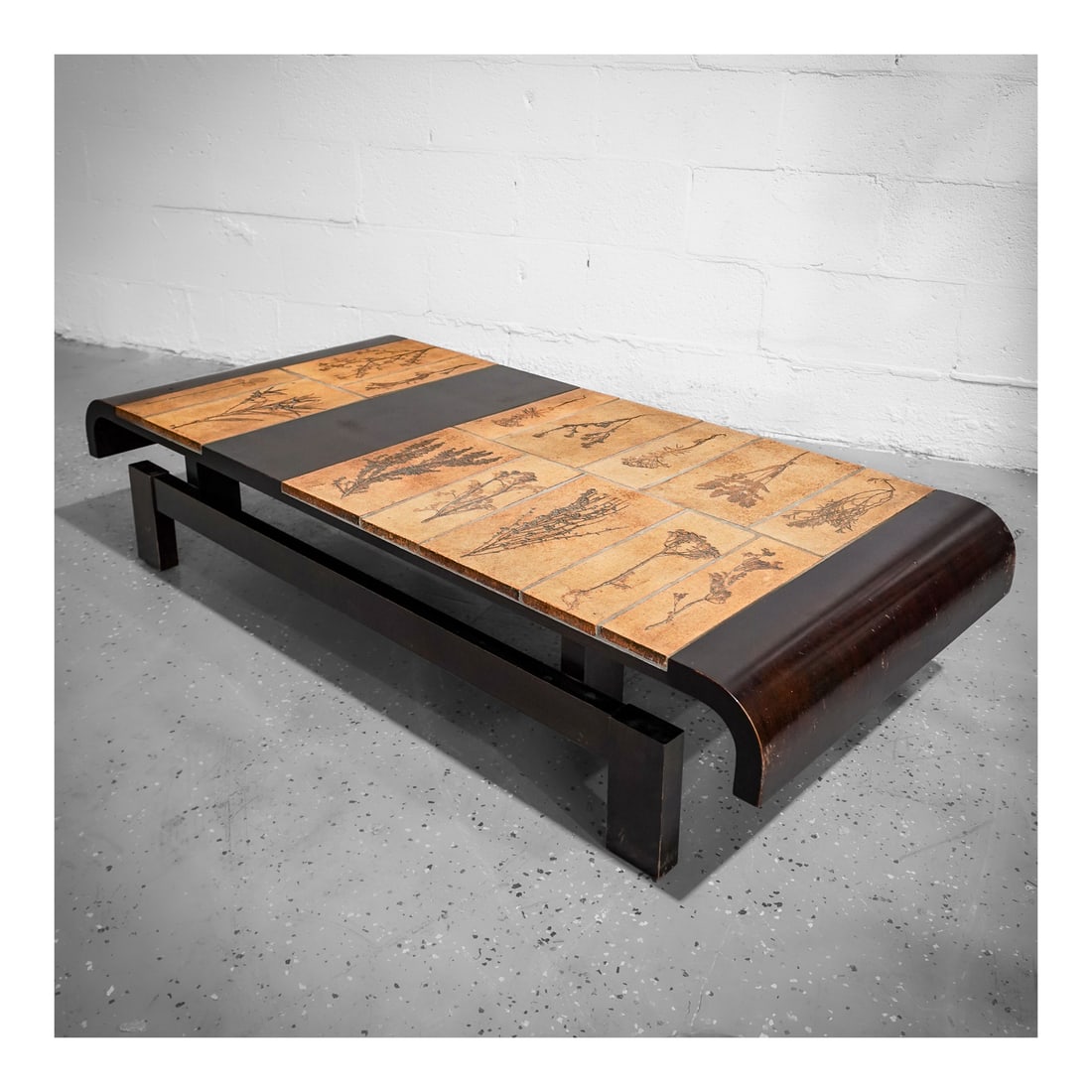 Signed Roger Capron (French, 1922-2006) "Herbarium" Large Garrigue Tile Table: Signed Roger Capron (French, 1922-2006) "Herbarium" Large Garrigue Tile Tablecirca 1970s, FrenchA large garrigue tile table featuring fourteen terracotta tiles with floral/herbal reliefs. Signed "R Ca