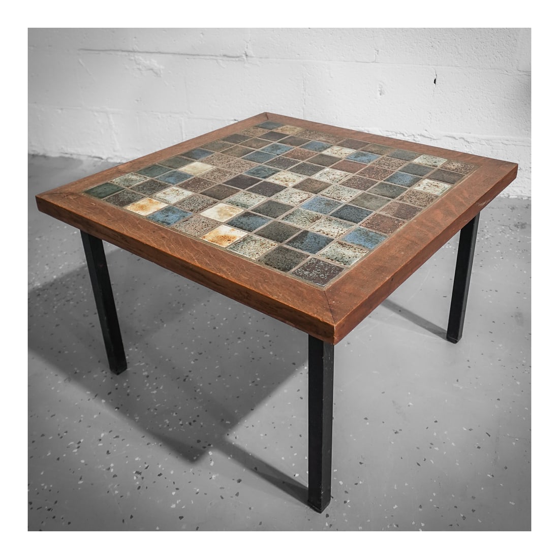 Modern Ceramic Side Table with Metal Feet: Modern Ceramic Side Table with Metal Feetcirca 1970s, ContinentalA modern designed ceramic enamel tiled side table with metal legs and feet.H 15" W 23 3/4"