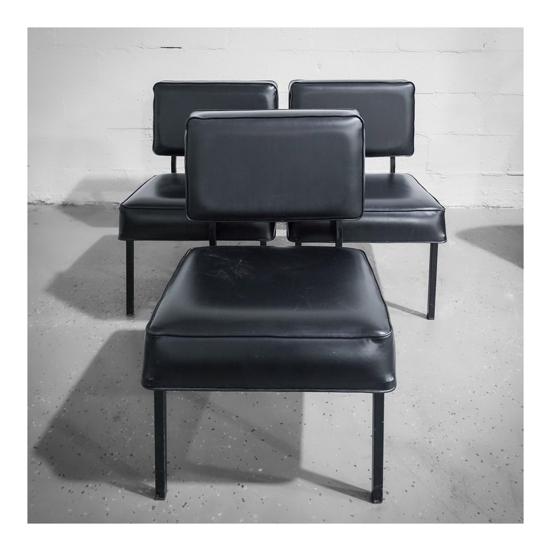 (3 pcs) MCM Pierre Guariche Black Leather Lounge Chairs: (3 pcs) MCM Pierre Guariche Black Leather Lounge Chairscirca 1960s, FranceA set of three mid-century modern black leather lounge chairs by Pierre Guariche. Stamped on bottom "UGAP 1968".H 27" W 19 1/2