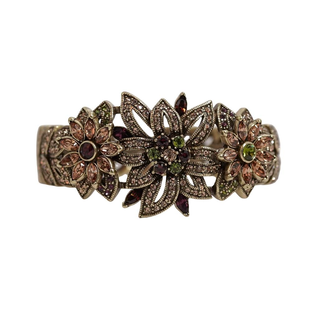 Heidi Daus Signature Swarovski Crystal Floral Bracelet: Heidi Daus Signature Swarovski Crystal Floral BraceletLate 20th century, AmericanHeidi Daus (American, est. 1981) metal and Swarovski crystal bracelet in her signature bronze-tone. Floral design featu