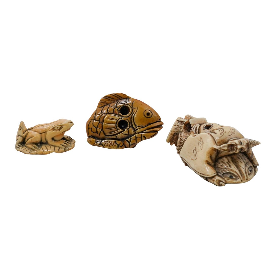 (3pc) Antique Japanese Carved Bone Netsuke Figures: (3pc) Antique Japanese Carved Bone Netsuke FiguresEarly 20th Cent. JapanA group of three small carved netsuke figures, each depicting different subjects. One is markedDia: 3/8"/ Dia: 5/8"/ Dia: 2"