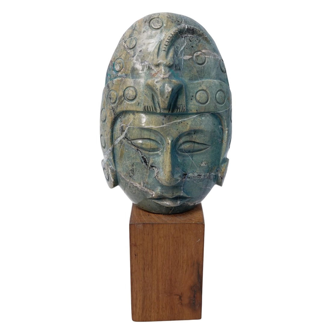 Carved Stone Mesoamerican Tribal Mask: Carved Stone Mesoamerican Tribal Mask20th c., MesoamericaCarved Mayan or Olmec style tribal mask with a lizard headdress mounted to a wood base.H: 11.75" W: 3" L: 5"
