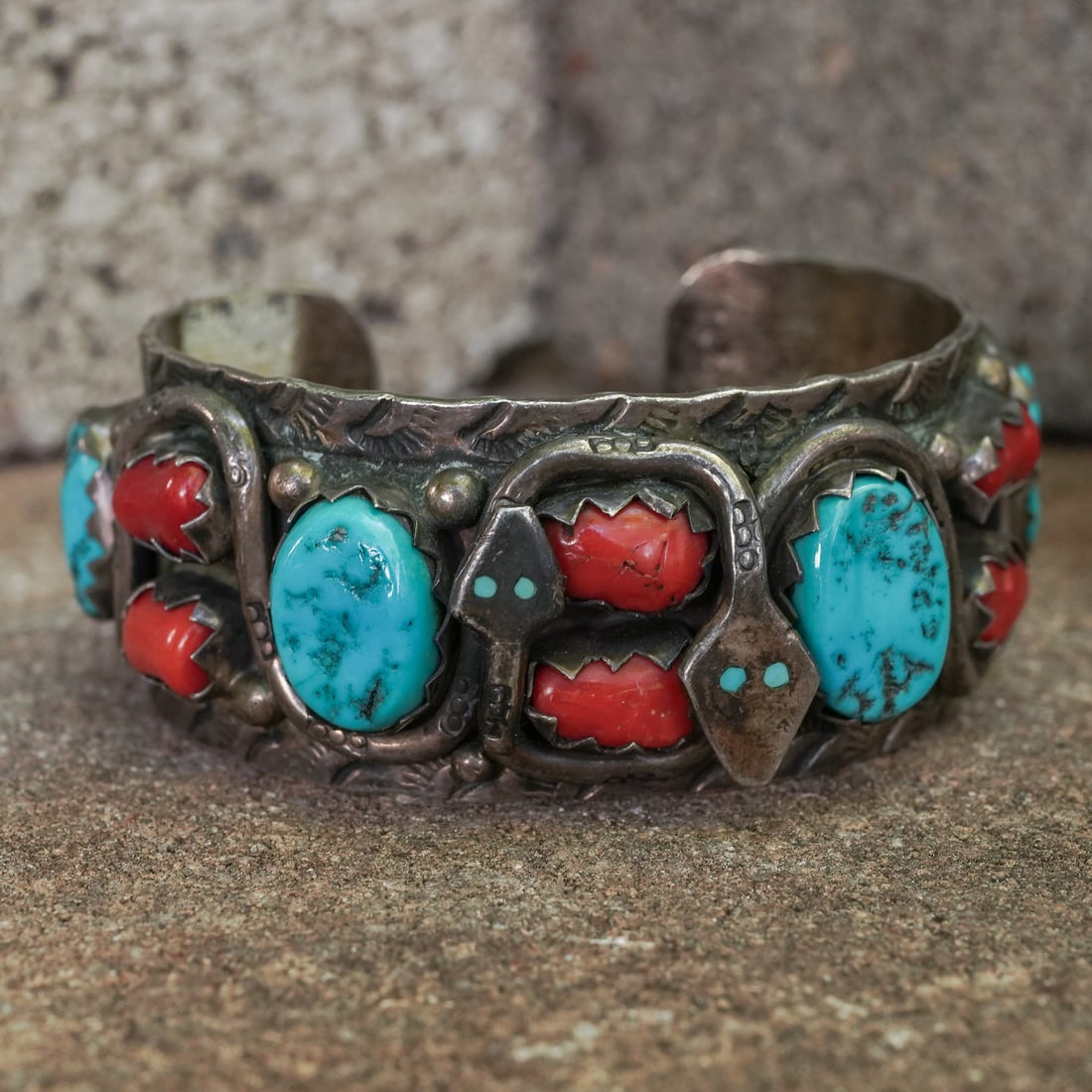 H. Spencer Navajo Sterling Silver Turquoise & Coral Cuff Bracelet: H. Spencer Navajo Sterling Silver Turquoise & Coral Cuff BraceletCirca 1970s–1980s, USA.Vintage Navajo handcrafted sterling silver cuff bracelet by H. Spencer, showcasing three large natural turquoi