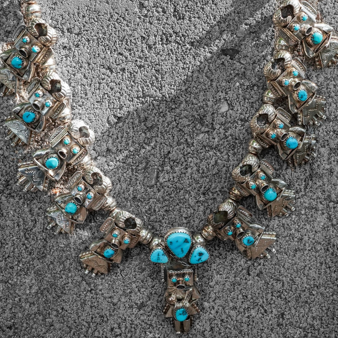 Doris Smallcanyon Sterling Silver & Turquoise Kachina Squash Blossom Necklace: Doris Smallcanyon Sterling Silver & Turquoise Kachina Squash Blossom Necklace Circa 1970s - 1980s, USA. Large and elaborate Navajo sterling silver squash blossom necklace by Doris Smallcanyon, featuri