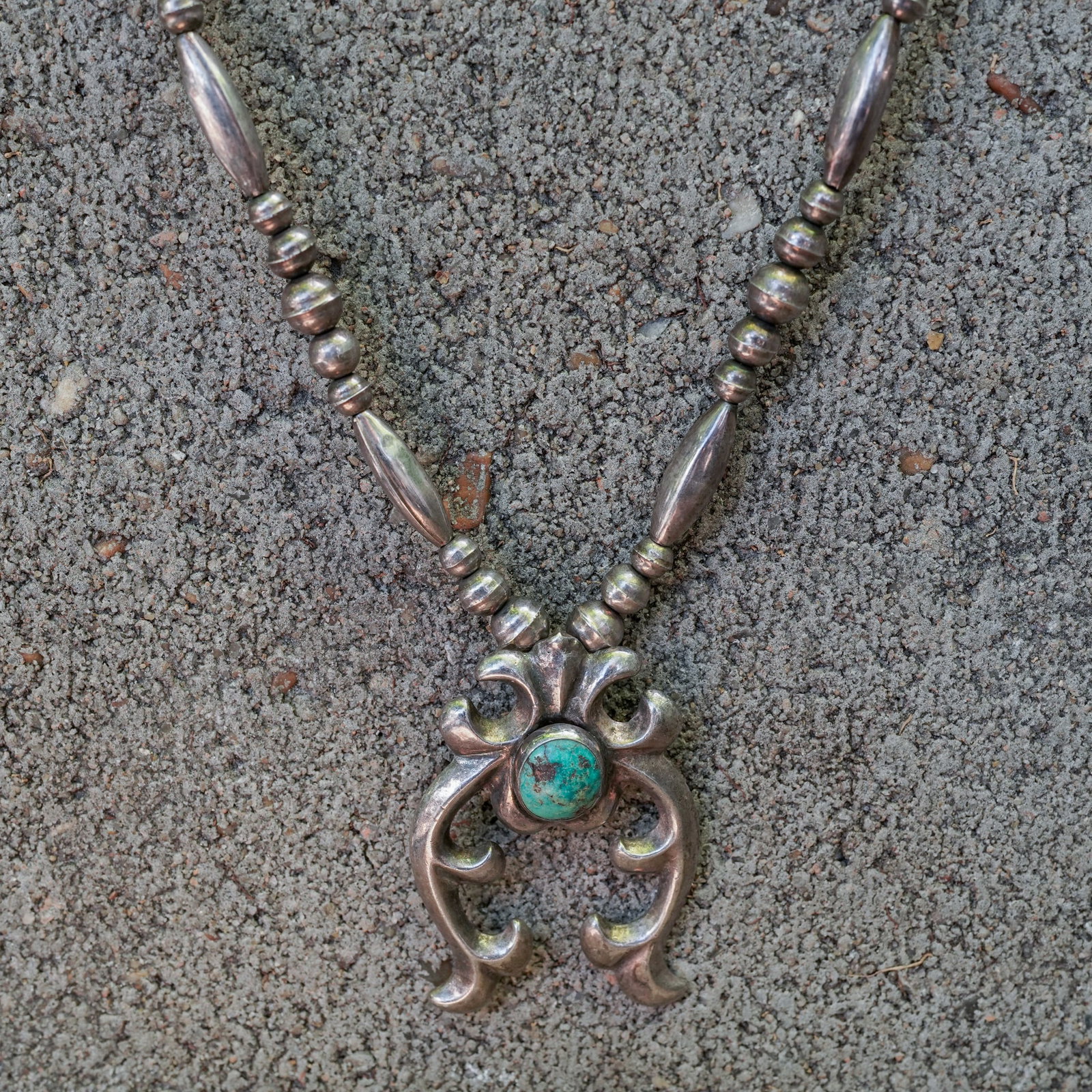Vintage Navajo Sterling Silver Turquoise Single-Naja Necklace: Vintage Navajo Sterling Silver Turquoise Single-Naja Necklace Circa 1960s–1970s, USA. Vintage handcrafted Navajo sterling silver necklace featuring a single open-work naja with a natural turquoise c