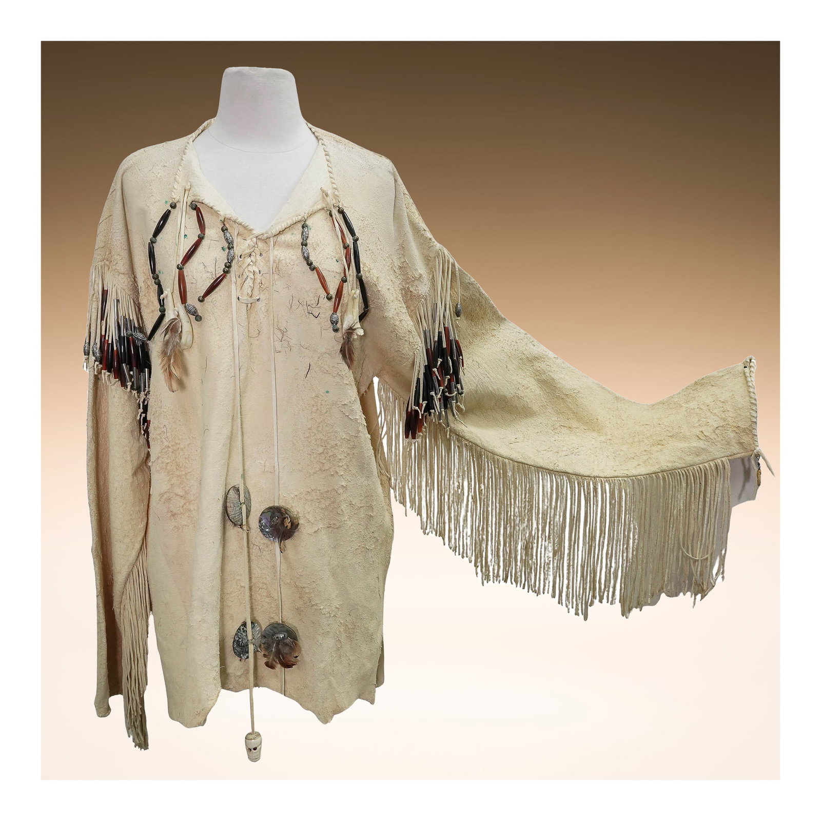 Native American Traditional Buckskin Shirt, Fringed, Beaded, w/ Dreamcatcher: Native American Traditional Buckskin Shirt, Fringed, Beaded, w/ Dreamcatcher20th century, Native AmericanGenuine hand crafted traditional Native American animal hide shirt, created using a tanning pro