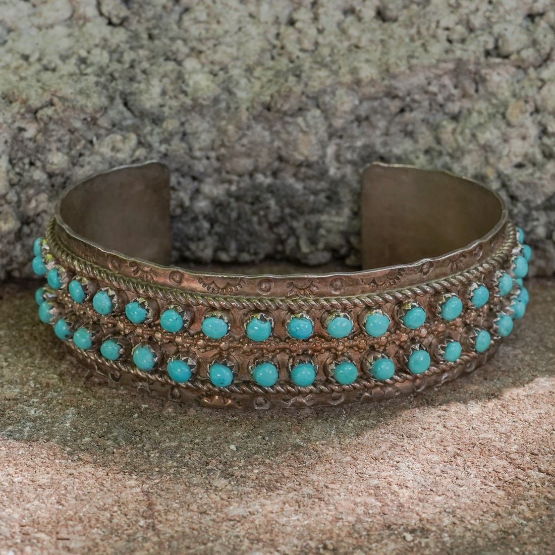 J. Pukestine Sterling Silver Turquoise Row Cuff: J. Pukestine Sterling Silver Turquoise Row CuffCirca 1970s, USA.Sterling silver cuff by J. Pukestine, set with two rows of small round turquoise cabochons, each individually bezel-set with surrounding
