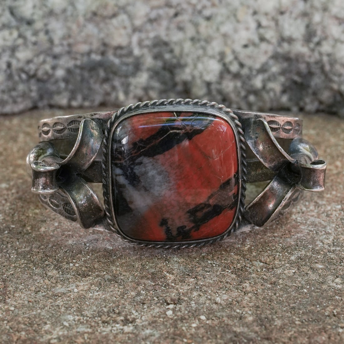 Navajo Sterling Silver & Jasper Cabochon Bracelet: Navajo Sterling Silver & Jasper Cabochon BraceletCirca 1970s–1980s, USA.A vintage Navajo sterling silver bracelet featuring a large jasper cabochon measuring approx. 28 mm × 25 mm, set within a hea