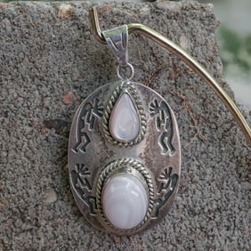 Sterling Silver Kokopelli Pendant with Pink Shell Cabochons