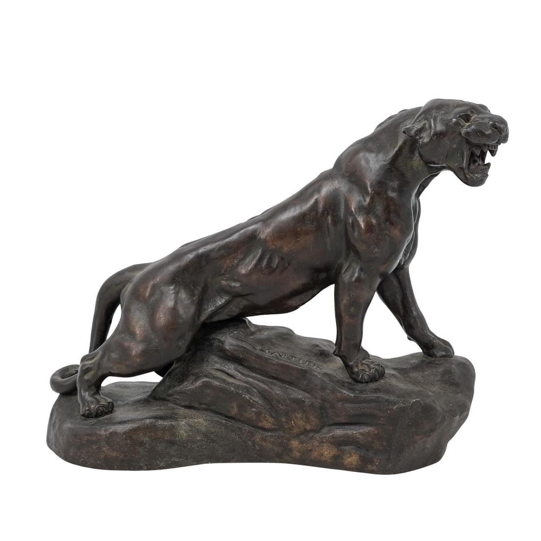 Thomas Cartier (1879-19430) Patinated Bronze "Growling Panther" Figure: Thomas Cartier (1879-19430) Patinated Bronze "Growling Panther" Figure20th Cent. FranceDynamic cast bronze depicting a powerful panther poised alertly atop a rocky outcrop.The figures showcases natura