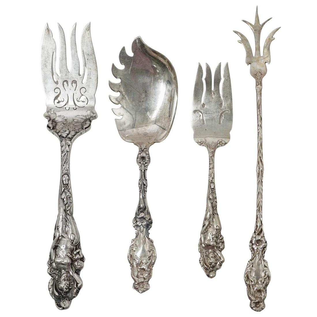 (4 Pc) Reed & Barton Sterling Silver Serving Utensils: (4 Pc) Reed & Barton Sterling Silver Serving Utensils1899-1905, USA(4 Pc) Reed & Barton Sterling Silver "Love Disarmed" Salad Serving UtensilsThe Pattern features an Art Nouveau style with a figural h