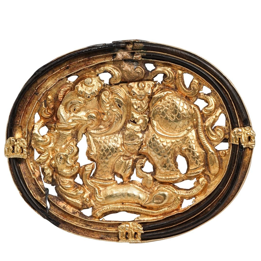 Antique Indian Mughal 22k Gold Elephant & Tiger Hair Brooch: Antique Indian Mughal 22k Gold Elephant & Tiger Hair BroochCirca 19th century, IndiaAntique Indian Mughal 22k gold hair brooch of oval form, finely worked in high-relief repoussé depicting an elephan