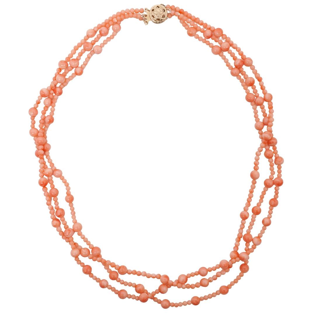 Vintage Coral Bead Necklace with 14k Gold Clasp: Vintage Coral Bead Necklace with 14k Gold ClaspCirca Mid-20th CenturyMulti-strand beaded necklace composed of graduated round coral beads arranged in three parallel strands, periodically interspersed
