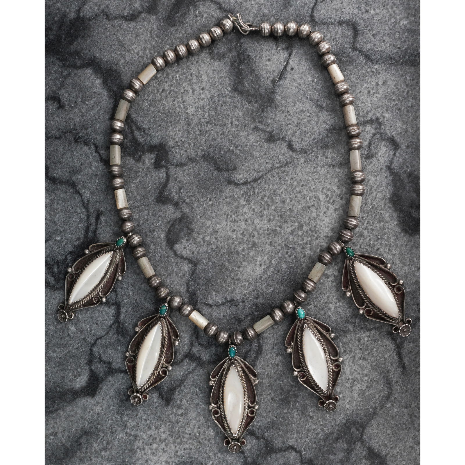 Vintage Navajo Sterling Silver Turquoise & MOP Necklace Signed: Vintage Navajo Sterling Silver Turquoise & MOP Necklace SignedCirca 1970s-1980s, USAVintage sterling silver necklace composed of six marquise-form mother-of-pearl cabochons each measuring approximatel