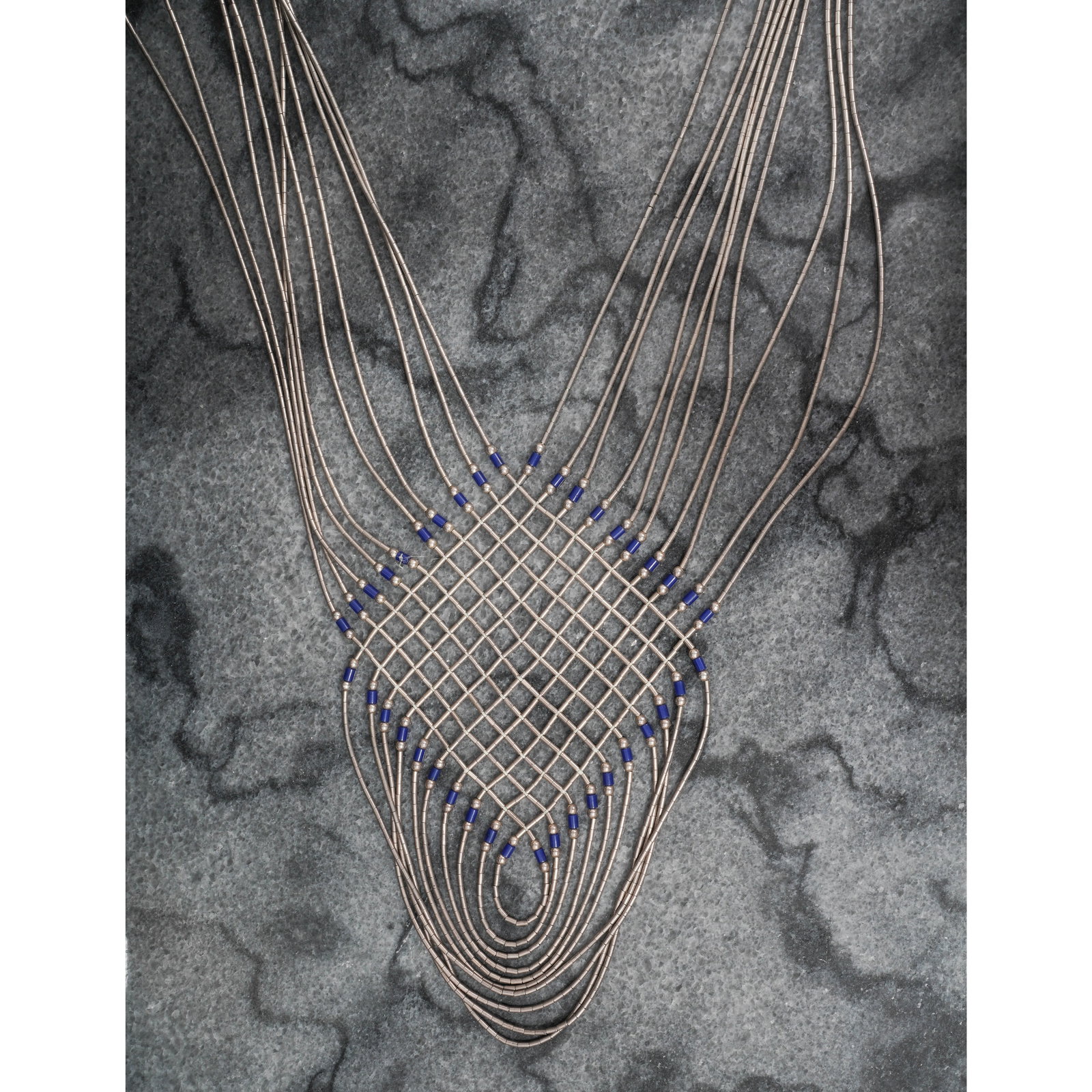 Vintage Navajo Lapis & Sterling Silver Woven Heishi Bead Necklace: Vintage Navajo Lapis & Sterling Silver Woven Heishi Bead NecklaceCirca 1960s-1970s, USAVintage Navajo multi-strand sterling silver necklace is constructed from fine tubular heishi forming a woven lapi