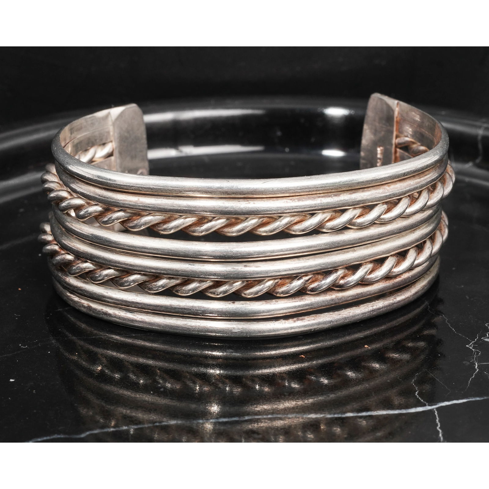 Vintage Navajo Sterling Silver Cuff Bracelet Signed: Vintage Navajo Sterling Silver Cuff Bracelet SignedCirca 1970s-1980s, USAVintage Navajo sterling silver cuff bracelet constructed of five parallel silver bands, including alternating smooth and twiste