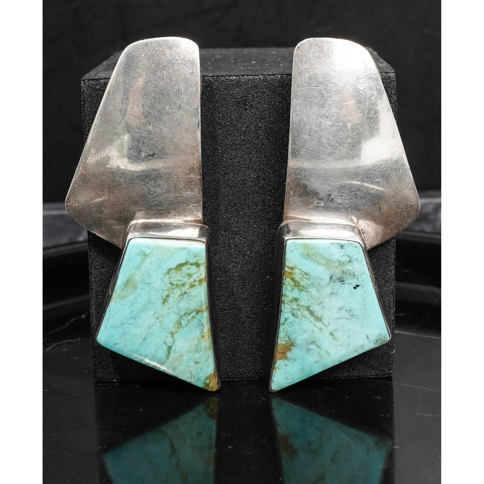 Marvin Slim Navajo Sterling Silver & Turquoise Earrings: Marvin Slim Navajo Sterling Silver & Turquoise EarringsCira 1990s-2000s USAA pair of modernist sterling silver earrings by Navajo silversmith Marvin Slim, each earring designed with a polished geometr