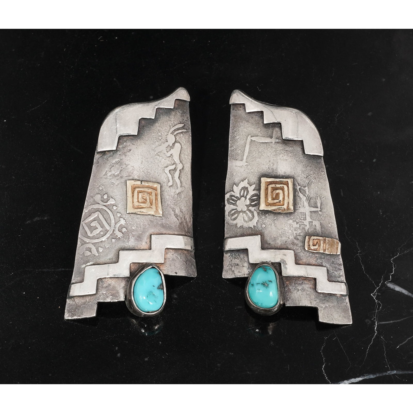 Hopi Sterling Silver & Turquoise Overlay Earrings Signed: Hopi Sterling Silver & Turquoise Overlay Earrings SignedCirca 1990s-2000s, USAPair of Hopi overlay earrings executed in die-cut and engraved sterling silver, centered with an oval natural turquoise ca
