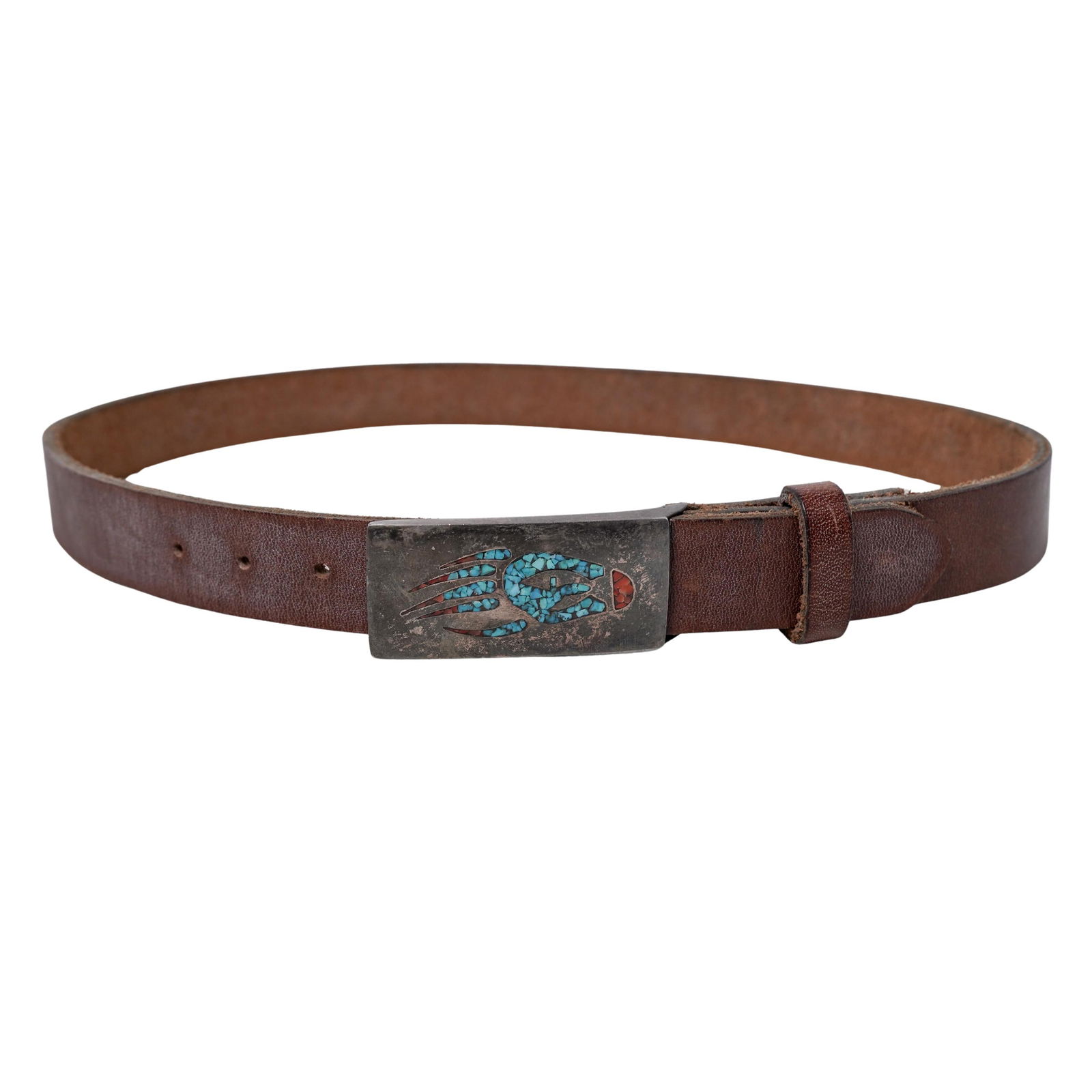 Navajo Leather Belt w/ Silver. Turquoise and Coral Buckle: Navajo Leather Belt w/ Silver. Turquoise and Coral BuckleEarly to mid 20th century, Native AmericanA hand-made leather belt with a silver Navajo belt buckle featuring a turquoise and coral bearclaw in