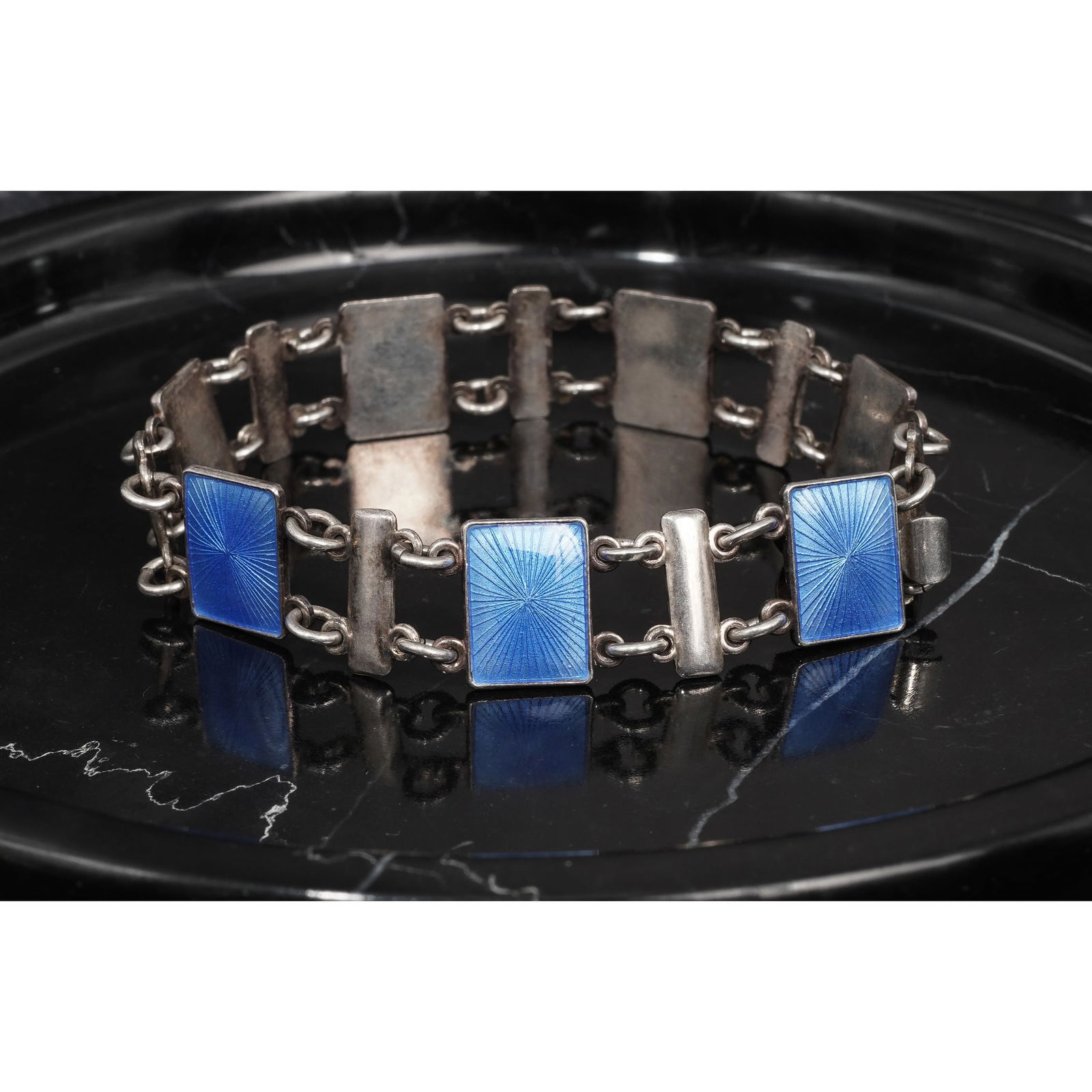Volmer Bahner Sterling Silver & Guilloche Enamel Bracelet: Volmer Bahner Sterling Silver & Guilloche Enamel BraceletCirca 1960s-1980s, DanishVintage sterling silver link bracelet with alternating guilloché enamel panels in deep cobalt blue, each panel approx