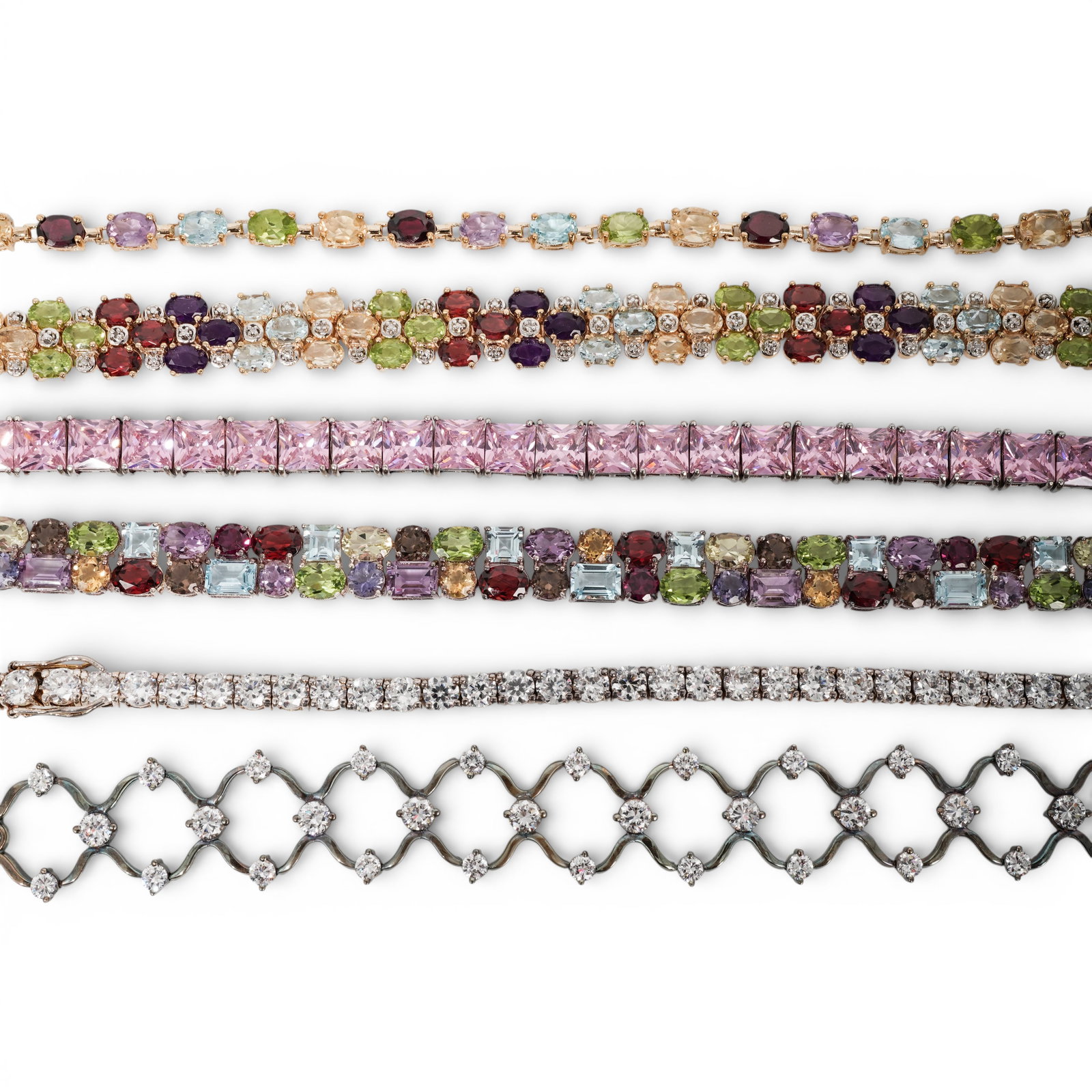 (6 Pcs) Sterling Silver & Synthetic Stone Bracelet Set: (6 Pcs) Sterling Silver & Synthetic Stone Bracelet SetCirca 2000s, AsianGroup of six sterling silver bracelets comprising: (1) openwork link bracelet set with round CZ accents measuring approximately