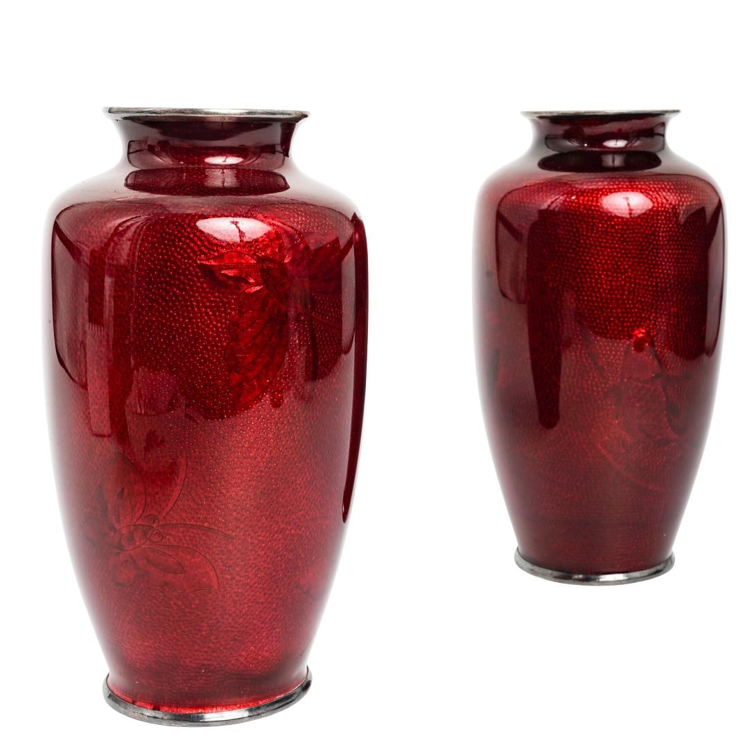 Pair Japanese Cloisonne Enamel Vases: (2pc) Japanese Cloisonne VasesMid 20th Cent., JapaneseJapanese cloisonne vases featuring a deep "pigeon blood" red color. This effect is achieved through the ginbari enameling technique in which a tex