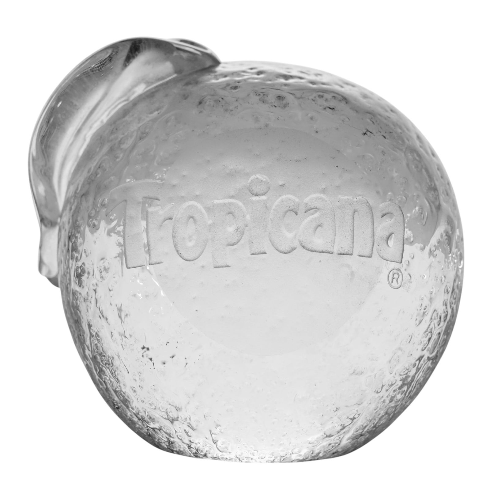 Vandermark Tropicana Glass Paperweight Advertising: Vandermark Tropicana Glass Paperweight AdvertisingCirca 1980. USAThis vintage Vandermark advertising glass paperweight is rendered in solid clear glass, featuring an orange with an attached leaf detai
