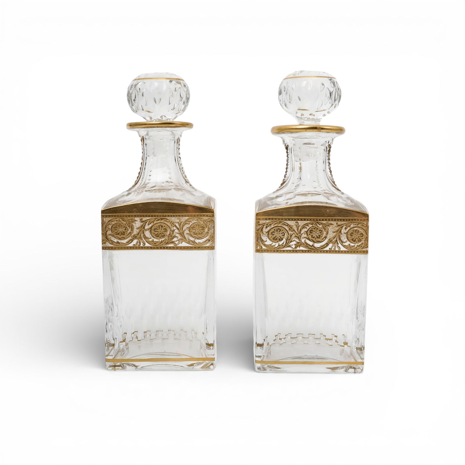 Pair Of St. Louis “Thistle" Crystal Whiskey Decanters: Pair Of St. Louis “Thistle” Crystal Whiskey DecantersEarly to mid 20th Cent., FrenchPairs of square Saint-Louis crystal whiskey decanters with stoppers in the "Thistle" pattern. This pattern w