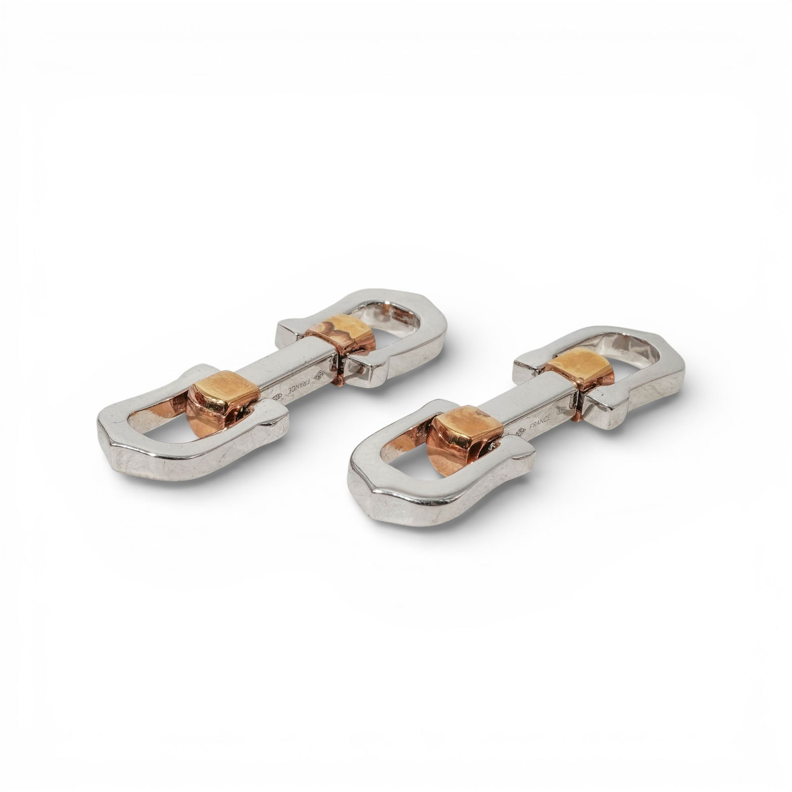 Cartier Sterling Silver and Gold Accent Cufflinks: Cartier Sterling Silver and Gold Accent Cufflinks1990s–2000s, FrancePair of Cartier sterling silver link cufflinks with yellow gold accents, designed as elongated open links joined by a central bar