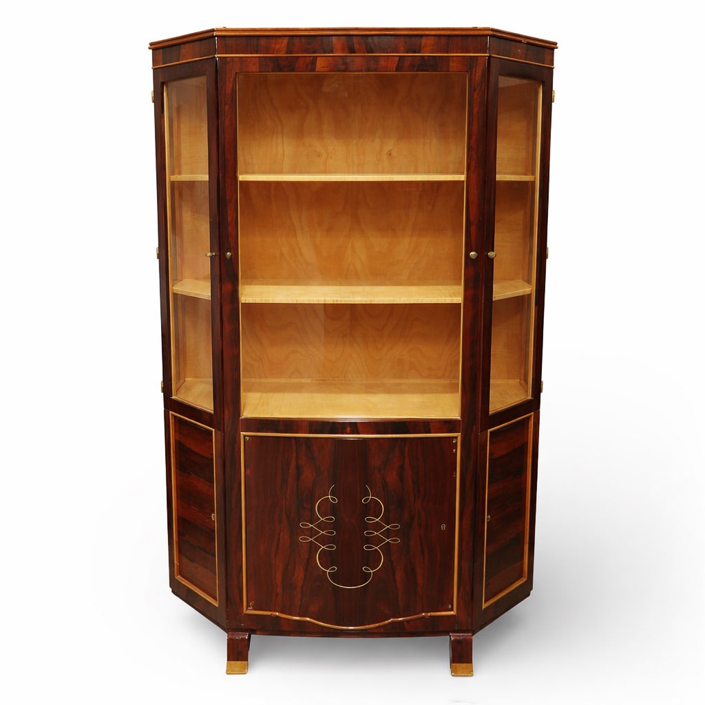 Art Deco Marquetry Display Cabinet: Art Deco Marquetry Display Cabinet Early 20th Cent. Art Deco vitrine cabinet featuring a multi-faceted glazed display upper section over a locking lower cabinet with integrated interior drawers. The