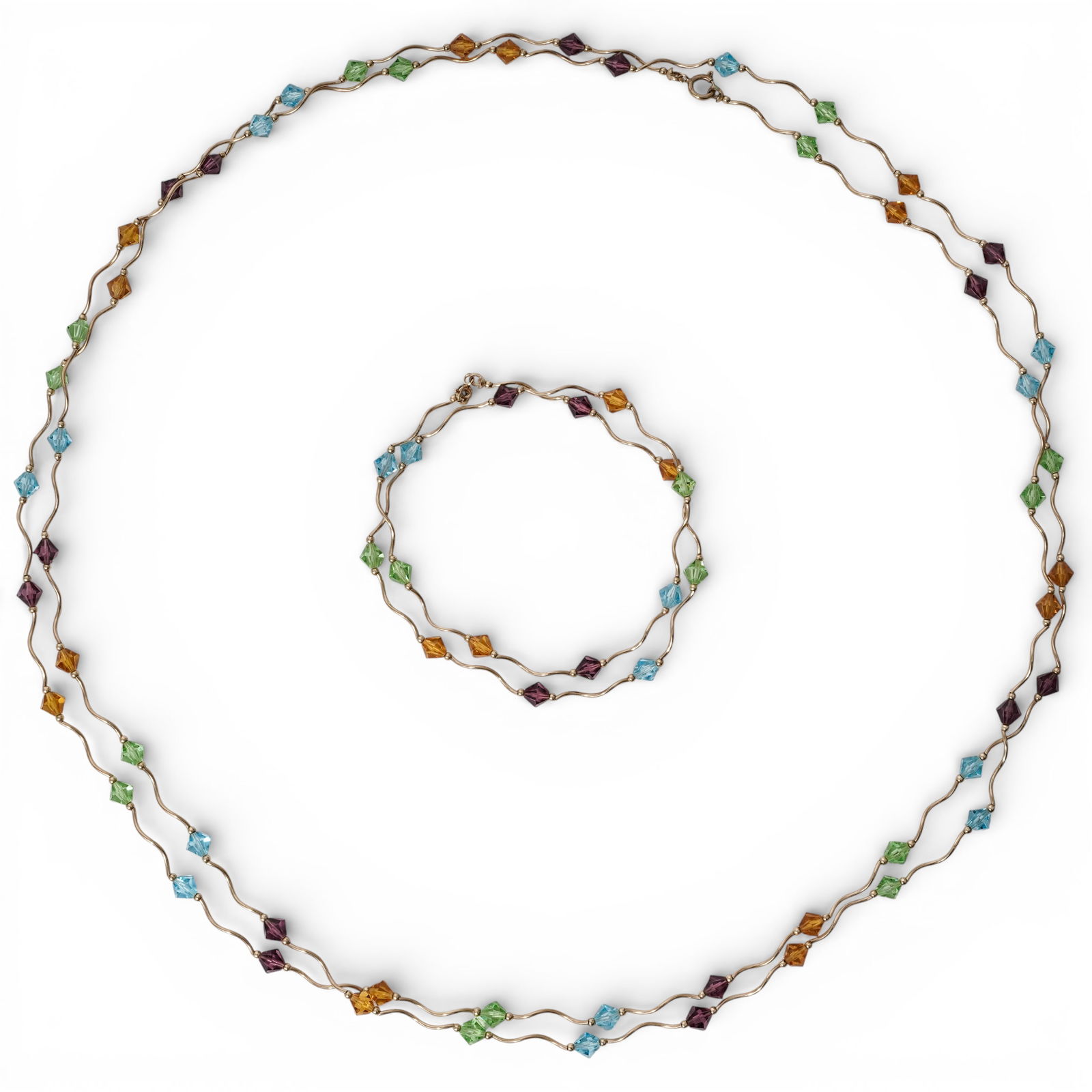 (2 Pcs) 14k Gold & Multicolor Bead Station Necklaces: (2 Pcs) 14k Gold & Multicolor Bead Station NecklacesLate 20th Cent.14k yellow gold station necklaces composed of undulating wire links alternating with faceted multicolor beads in blue, green, purple,