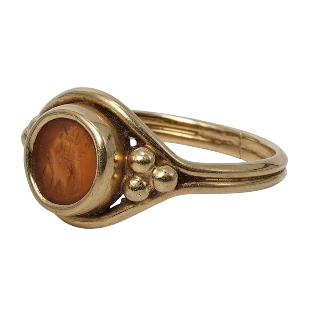18k Gold Roman Ring with Carnelian Intaglio Sphinx: 18k Gold Roman Ring with Carnelian Intaglio Sphinx20th Cent, Rome18k yellow gold ring featuring a round carnelian intaglio depicting a sphinx figure in low relief, bezel-set within a smooth, raised go