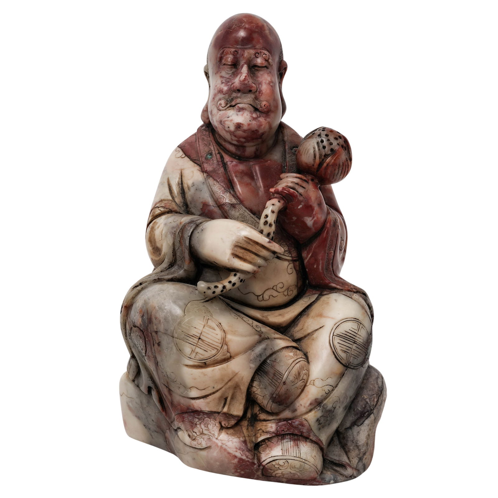 Chinese Carved Shoushan Chicken Blood Stone Luohan: Chinese Carved Shoushan Chicken Blood Stone Luohan 19th century, Chinese The figure is carved from Shoushan cream and reddish-brown stone, it is seated and holds a lotus bud in its right hand. H.