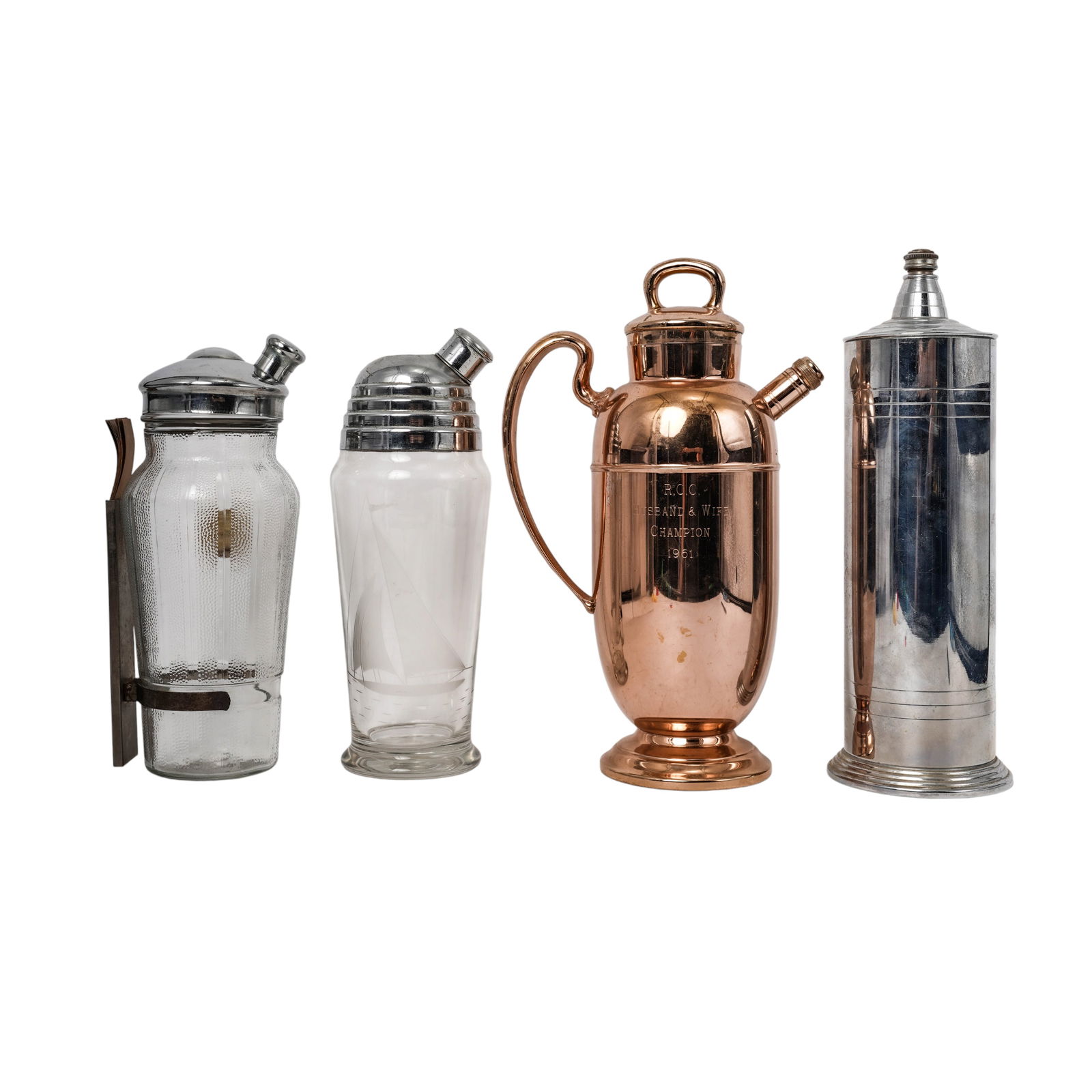 (4pc) Vintage Group Vintage Chorme & Glass Cocktail Shakers: (4pc) Vintage Group Vintage Chorme & Glass Cocktail ShakersMid 20th Cent.,AmericanA vintage group of four cocktail shakers, comprising;_One brass example engraved "R.C.C. Husband & Wife Champion 1961"