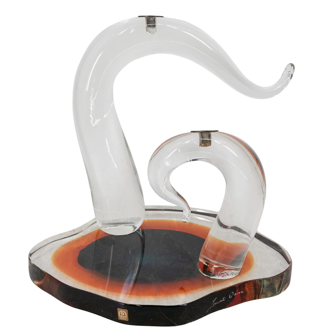 Oscar Zanetti Murano Glass Modernist Sculpture Base: Oscar Zanetti Murano Glass Modernist Sculpture Base Late 20th c., Italy Large Murano art glass sculpture featuring two curls emerging from a clear and amber glass base. The curls each have a bronze