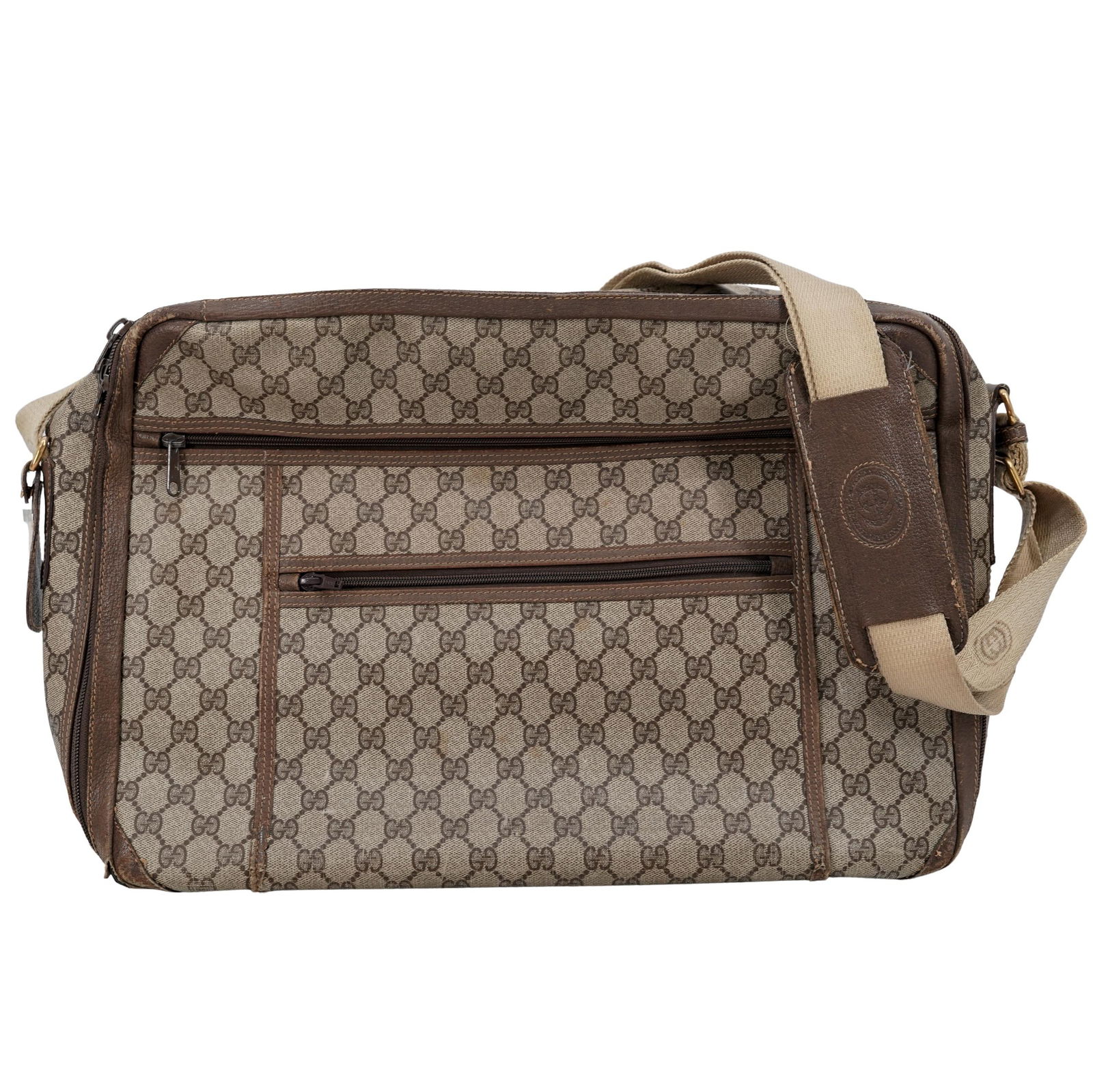 Vintage Gucci Messenger Bag: Vintage Gucci Messenger Bag Mid to Late 20th c., Italy Vintage Gucci monogrammed canvas messenger bag featuring brown leather lining and accents, with tan suede on the interior. It has gold-brushed