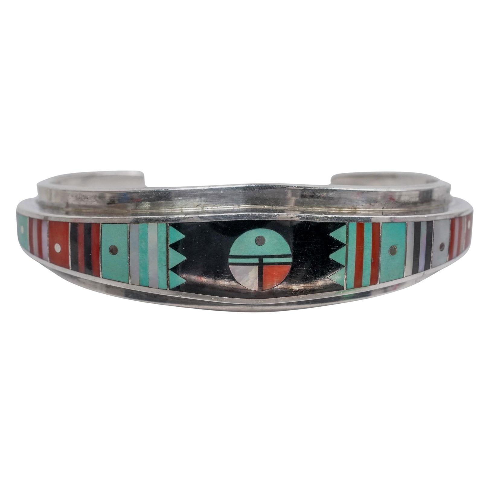 Ernest Benally Navajo Sterling Cuff Bracelet: Ernest Benally Navajo Sterling Cuff Bracelet Mid to late 20th century, Navajo A vintage stone and mother of pearl inlaid sterling silver cuff bracelet by Ernest Benally. Marked with "E. Benally"