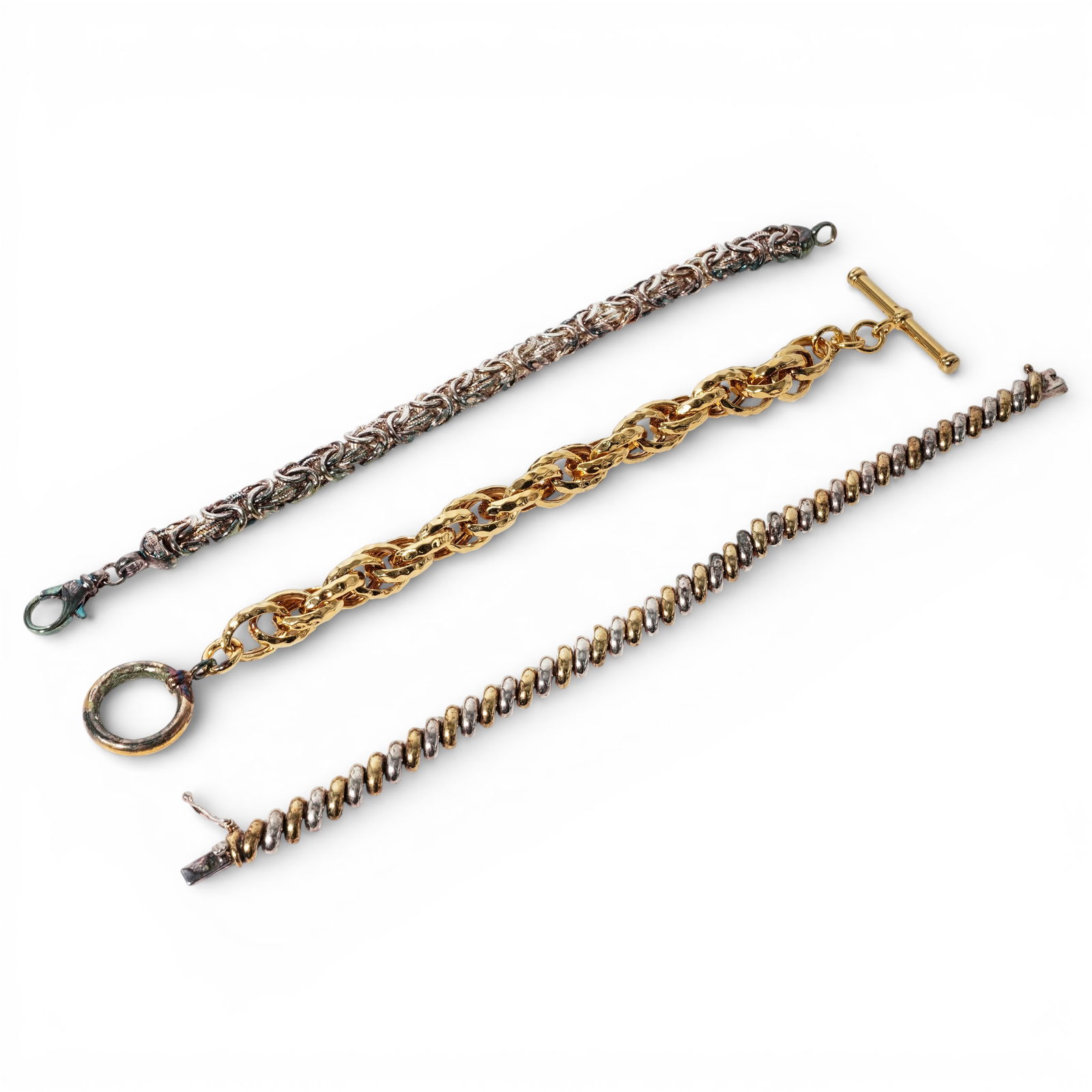(3 Pcs) Italian Sterling Silver Bracelet Set: (3 Pcs) Italian Sterling Silver Bracelet Set Late 20th Century, Italian Group of three Italian sterling silver chains. Bracelets designed with byzantine, twist and spiral construction and secure