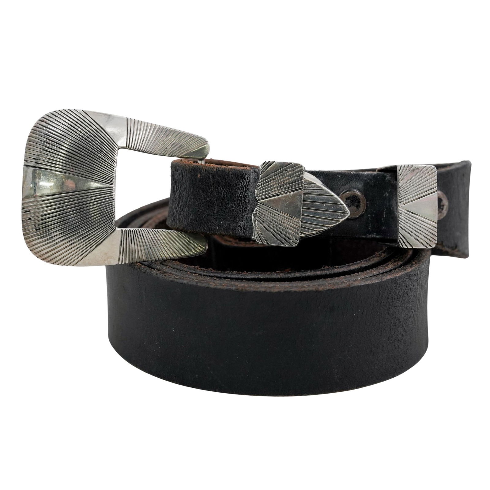 Anderson Parkett Navajo Sterling Silver and Leather Belt: Anderson Parkett Navajo Sterling Silver and Leather Belt20th century, AmericanA Navajo leather belt with sterling silver buckle and hardware by Anderson Parkett. Marked on hardware at tip "Anderson Pa